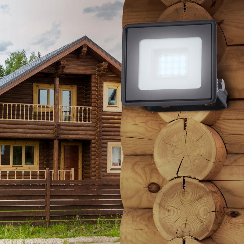 brown wooden house behind wooden fence
